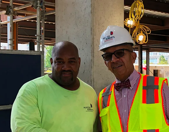 Jimmy Harris on a job site with a site supervisor